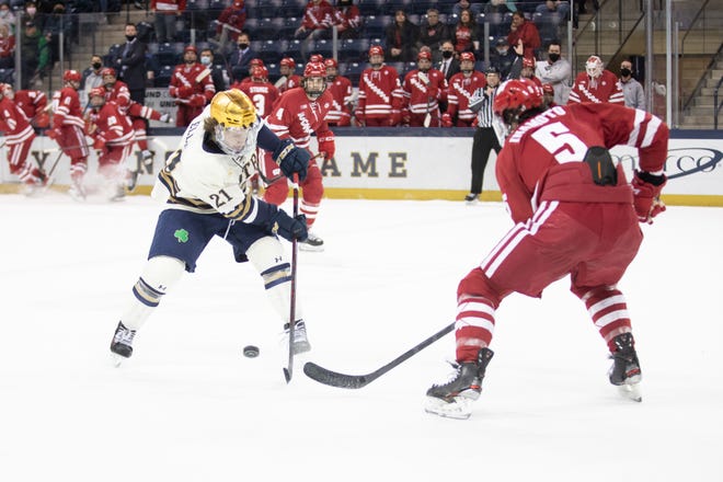 Notre Dame's Max Ellis skates with the puck during the Wisconsin-Notre Dame Big Ten hockey tournament game on Sunday, March 06, 2022, at Compton Family Ice Arena in South Bend, Indiana.